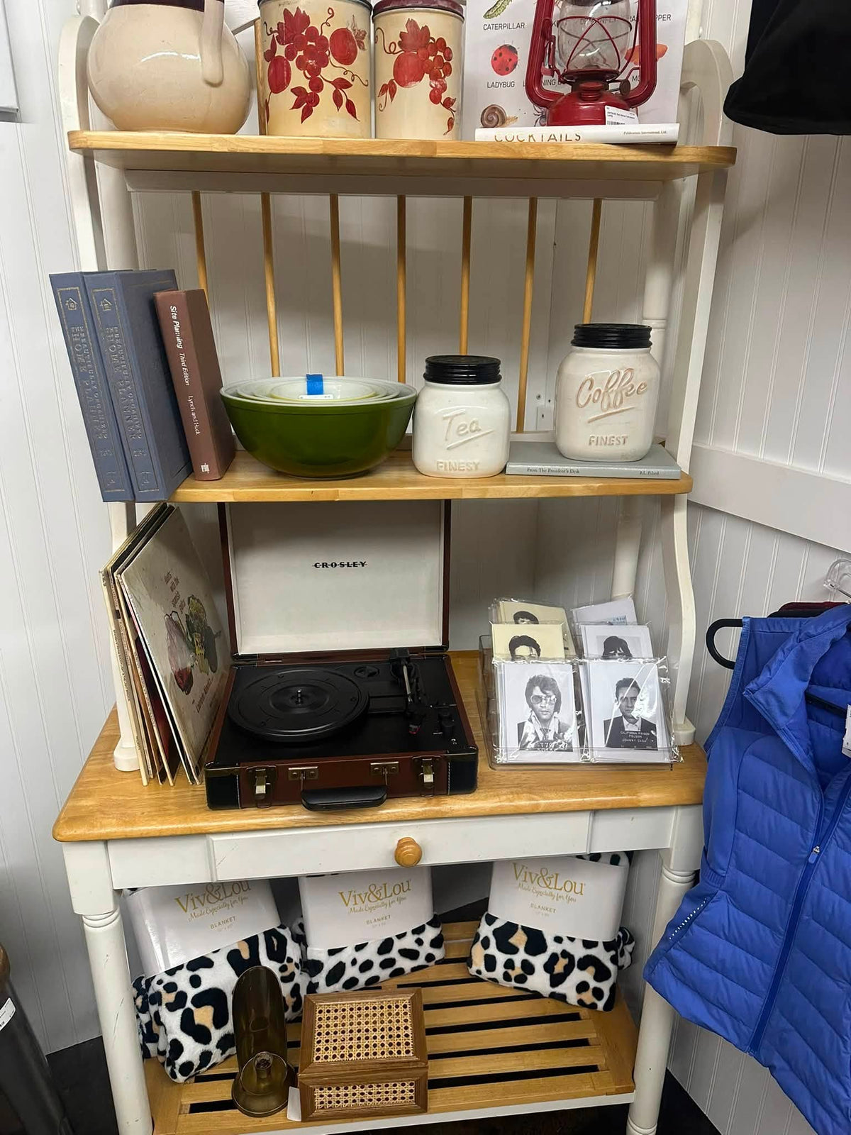 Record player, vinyl and Pyrex on a white hutch