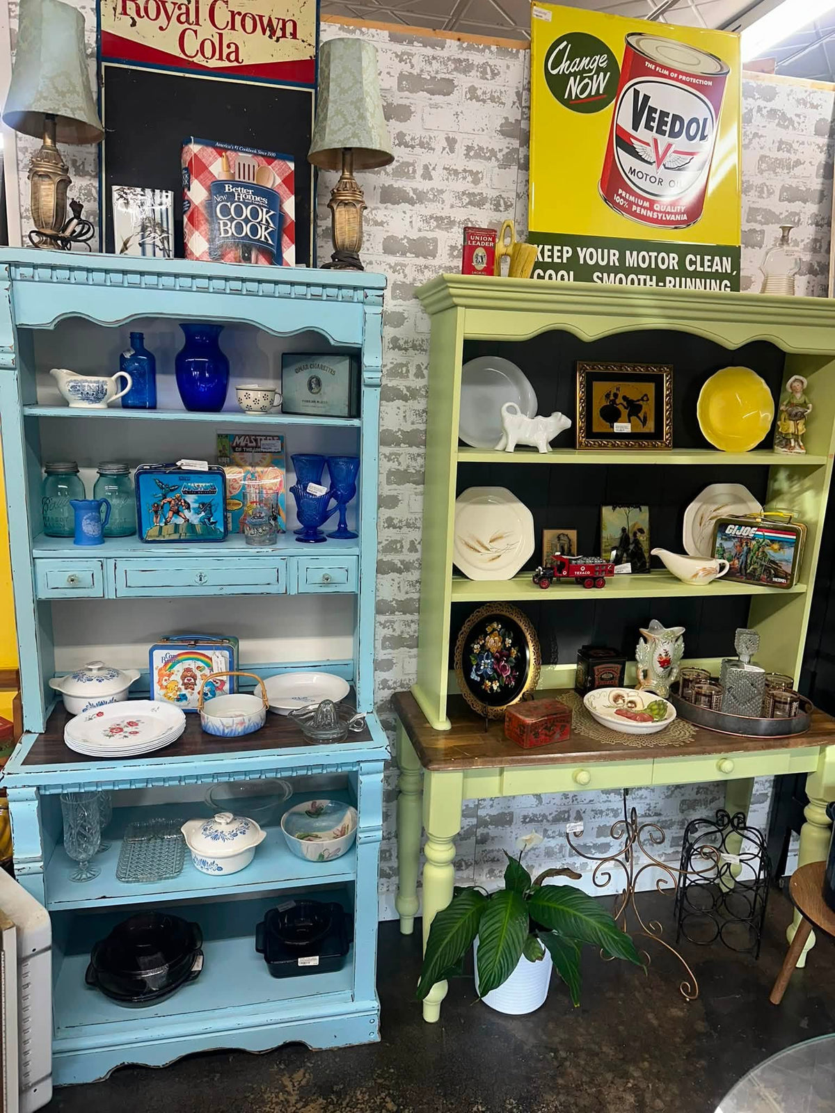 Painted turquoise and green hutches with blue glass and lunchboxes